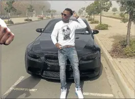  ?? PHOTO: FACEBOOK ?? FLASHY: Teko Modise next to his BMW, one of the many he had flaunted throughout his soccer playing career