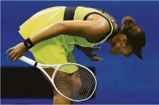  ?? Elsa / Getty Images ?? Naomi Osaka reacts after losing a point during a tiebreaker against Leylah Fernandez of Canada. Osaka threw her racket three times and hit a ball into the stands in the loss.