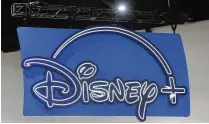  ?? CHRIS DELMAS / AFP / GETTY IMAGES ?? The logo of the Disney+ streaming service hangs above their booth during San Diego Comic-con Internatio­nal on July 24, 2022, in San Diego.