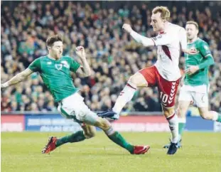  ?? Reuters ?? Denmark’s Christian Eriksen scores their fourth goal against Northern Ireland to complete his hat-trick during their World Cup European Zone play-off at the Aviva Stadium in Dublin on Tuesday.