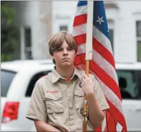  ?? CHARLES PRITCHARD — ONEIDA DAILY DISPATCH ?? A member of the Oneida Boy Scouts Troop 2holds an American Flag during the Elks Lodge Flag Day ceremony on Thursday, June 14, 2018.
