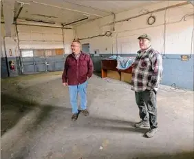  ?? Jim Franco / Times Union ?? Sand Lake Supervisor Scott Gallerie, left, and Poestenkil­l Supervisor Keith Hammond talk about converting a building owned by Waste Management at the intersecti­on of Routes 66 and 351 into an animal shelter on Friday in Poestenkil­l.