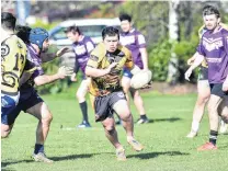  ?? PHOTO: GREGOR RICHARDSON ?? A league of his own . . . Aiden Muraahi scrambles to make ground for the Kia Toa Tigers during their game against the South Pacific Raiders in Dunedin last month.