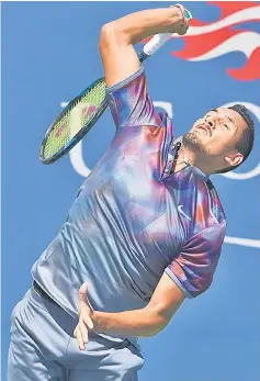  ??  ?? Nick Kyrgios serves to John Millman during their qualifying men’s singles match at the US Open Tennis Tournament in New York. — AFP photo