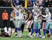  ?? CURTIS COMPTON / CCOMPTON@AJC. COM ?? Cowboys kicker Brett Maher (2) and teammates celebrate his winning field goal against the Falcons on Nov. 18. Falcons coach Dan Quinn’s timeouts gave Dallas extra time to set up the winning kick.