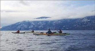  ?? MORAG STEVENSON/Special to The Okanagan Weekend ?? Members of the Kelowna Canoe and Kayak Club participat­ed in their annual New Year’s Day paddle, paddling more than six kilometres along the Okanagan Lake shoreline on Tuesday.