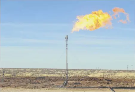  ?? Michael Stravato / The New York Times archive ?? Natural gas is flared at a well site north of Odessa, Texas. The Trump administra­tion has proposed to sharply curtail the regulation of methane emissions, a major contributo­r to climate change.