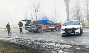  ?? BILL HODGINS TORSTAR ?? Police block off a road off Pigeon Lake Road just east of Lindsay for an investigat­ion after a one-year-old boy was shot dead and an Ontario Provincial Police officer was seriously injured.
