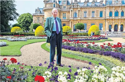  ?? ?? Rothschild at Waddesdon Manor, the Buckingham­shire château which he restored, in the parterre themed for the Coronation of King Charles