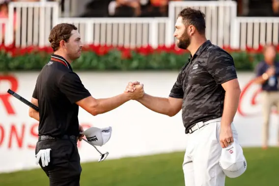  ?? Cliff Hawkins, Getty Images ?? Patrick Cantlay, left, and Jon Rahm shake hands on the 18th green at the conclusion of the third round of the Tour Championsh­ip on Saturday at East Lake Golf Club in Atlanta.