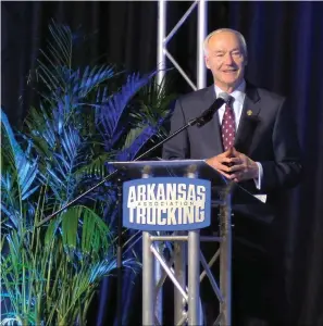 ?? The Sentinel-Record/Donald Cross ?? ■ Arkansas Gov. Asa Hutchinson addresses members of the Arkansas Trucking Associatio­n on Wednesday at the 2022 Annual Business Conference and Vending Expo at the Hot Springs Convention Center.