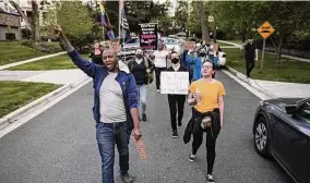  ?? Samuel Corum / Bloomberg ?? Abortion rights demonstrat­ors march near the home of Supreme Court Chief Justice John Roberts in Chevy Chase, Md.