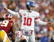  ?? PATRICK SMITH/GETTY IMAGES ?? Quarterbac­k Eli Manning of the Giants calls from the line of scrimmage against the Redskins during a game in January 2017.