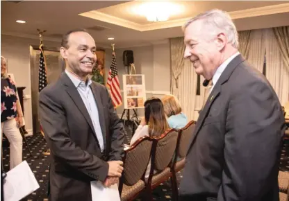  ?? PAT NABONG/SUN-TIMES ?? Former U.S. Rep. Luis Gutierrez greets U.S. Sen. Dick Durbin Friday at the Union League Club of Chicago where they discussed immigratio­n reform, including Gutierrez’s effort to help more than 1 million green card holders become U.S. citizens.