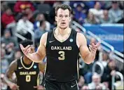  ?? MATT FREED / AP ?? Oakland’s Jack Gohlke celebrates after shooting a 3-pointer in Saturday’s NCAA game against North Carolina State in Pittsburgh.