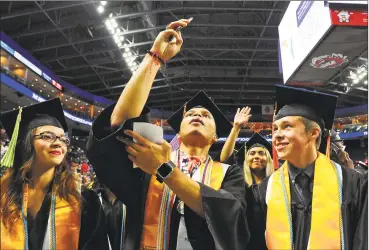  ?? Hearst Connecticu­t Media file photo ?? Interdistr­ict Science Magnet School graduates pose for a selfie in June 2017 in Bridgeport.