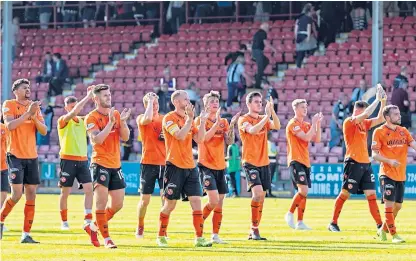  ?? Picture: SNS Group. ?? The Dundee United players show their appreciati­on to the 2,500-plus travelling support at East End Park on Saturday.