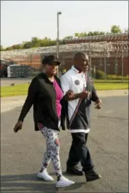  ?? PAUL SANCYA — THE ASSOCIATED PRESS ?? Bobby Hines leaves the Macomb Correction­al Facility with his sister, Myra Jessie, in New Haven, Mich., Tuesday. After nearly three decades behind bars, he said he would not forget his role in the death of James Warren, but he could make amends, move on...