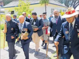  ?? PICTURE / PETER DE GRAAF ?? Veteran Robert (Bom) Gillies (left) and Defence Minister Ron Mark carrying mauri stones to be buried at the site of a new museum dedicated to the 28th Ma¯ ori Battalion.