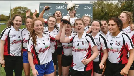  ??  ?? IT Sligo team captains Ann Sheridan and Rachael Connelly lift the cup as their team-mates celebrate after the Intermedia­te final against Maynooth University at the 2018 Gourmet Food Parlour HEC Freshers Blitz at Dublin City University in Dublin. Pic: Matt Browne/Sportsfile.