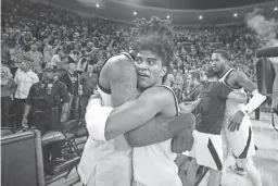  ??  ?? Arizona State guard Remy Martin hugs forward Romello White after ASU beat Arizona on Saturday in Tempe.
Radio: 98.7 FM: The Sun Devils are coming off a 66-65 win over rival Arizona in which they rallied from a 22-point deficit. Junior PG Remy Martin tallied 24 points and now leads the Pac-12 in scoring (19.7 ppg). Junior forward Romello White (10.4 ppg, 9 rpg) has seven double-doubles on the season. Sophomore C.J. Elleby (18.4 ppg, 7.1 rpg) leads Washington State which has already won more games than it did last year when it finished 11-21 overall and 4-14 in conference play.