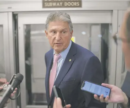  ?? J. SCOTT APPLEWHITE/AP ?? Sen. Joe Manchin, D-W.Va., talks to reporters in Washington last week.