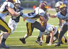  ?? STAFF FILE PHOTO BY ROBIN RUDD ?? Dade County running back Malaki Webb, center, is being counted on for good production again this season after rushing for 1,200 yards as a sophomore in 2017.