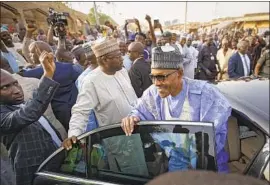  ?? Ben Curtis Associated Press ?? NIGERIAN President Muhammadu Buhari in his hometown of Daura after voting on Saturday. The former military dictator won by nearly 4 million votes.