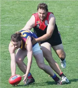  ??  ?? Gulls’ reserves team captain Jamie Somers tackles his Moe opponent trying to gather a ground level ball during Saturday’s match.