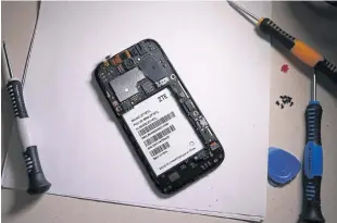  ?? REUTERS ?? The inside of a ZTE smartphone is pictured in this illustrati­on taken on Tuesday.