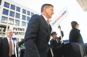  ?? Tom Brenner / New York Times 2018 ?? Former National Security Adviser Michael Flynn arrives at a district court in Washington to be sentenced in 2018. He admitted lying to FBI agents.