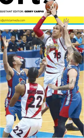  ?? MIGUEL DE GUZMAN ?? San Miguel Beermen’s June Mar Fajardo takes an open shot over Magnolia’s Ian Sangalang and Robbie Herndon in the second game of their best-of-seven Philippine Cup title series last night at the SM Mall of Asia Arena.