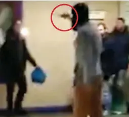  ??  ?? People filmed the knife (circled) but did nothing about the knifeman