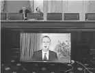  ?? MICHAEL REYNOLDS/ AP ?? Facebook CEO Mark Zuckerberg appears on a screen as he speaks remotely during a hearing before the Senate Commerce Committee on Capitol Hill on Wednesday.