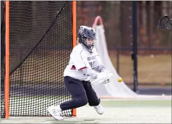  ?? JAMES THOMAS PHOTO ?? Westford Academy goalie Ava Preysnar blocks a shot during an 18-10girls lacrosse victory over Nashoba Regional on Friday in Westford.