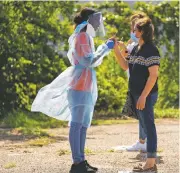  ?? NITASHIA JOHNSON/NEW YORK TIMES ?? Walk-up testing for COVID-19 is conducted Thursday outside the Friendship-West Baptist Church in Dallas.