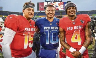 ?? Mark Brown / Getty Images ?? DeshaunWat­son, right, and Mitchell Trubisky, center, both played in the Pro Bowl after the 2018 season, along with Patrick Mahomes. WhileWatso­n’s career is thriving, Trubisky’s has stalled.