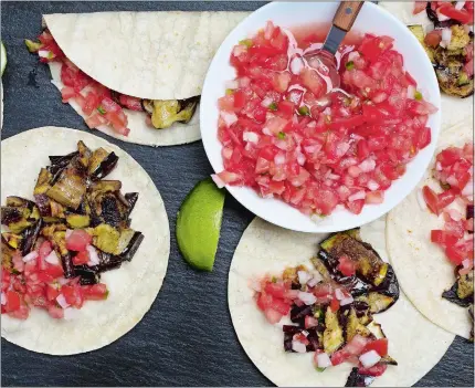  ?? DEB LINDSEY/THE WASHINGTON POST ?? Eggplant tacos with pico de gallo