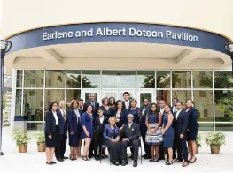  ?? DOTSON FAMILY ?? Earlene and Albert Dotson Sr., center, are surrounded by children and grandchild­ren during the opening ceremony of a new FIU pavilion bearing their name in 2019.