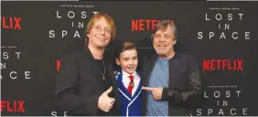  ??  ?? ORIGINAL Lost In Space cast member Bill Mumy (L) goofs around with his 2018 counterpar­t Maxwell Jenkins (C) and Mark Hamill during the premiere for the Netflix remake on April 9, in Los Angeles.
