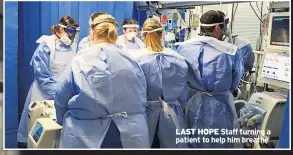  ??  ?? LAST HOPE Staff turning a patient to help him breathe