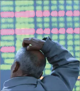  ?? PHOTO: REUTERS ?? An investor looks at an electronic screen at a brokerage house in Hangzhou, Zhejiang Province, China, yesterday, as stocks closed at their lowest since September.