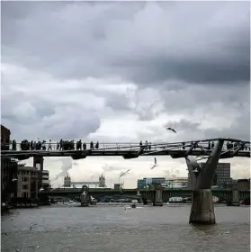  ??  ?? The Millennium Bridge in London had to close for repairs when pedestrian traffic became too heavy, compromisi­ng the integrity of the structure.
