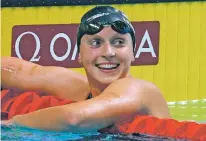  ?? DARKO BANDIC/THE ASSOCIATED PRESS ?? United States’ Katie Ledecky wins the gold medal in the women’s 1500-meter freestyle final during the swimming competitio­ns of the World Aquatics Championsh­ips on Tuesday in Budapest, Hungary.