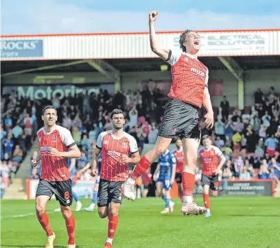  ?? Pictures: Nizaam Jones/ JMP ?? Callum Wright leaps in celebratio­n after making it 1-1 against Gillingham