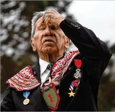  ?? VIRGINIA MAYO / ASSOCIATED PRESS ?? D-Day veteran Charles Shay does a Native American ceremony Friday overlookin­g Omaha Beach in Saint-Laurent-sur-Mer, France. Today’s anniversar­y will be low-key, as the pandemic is keeping most away.