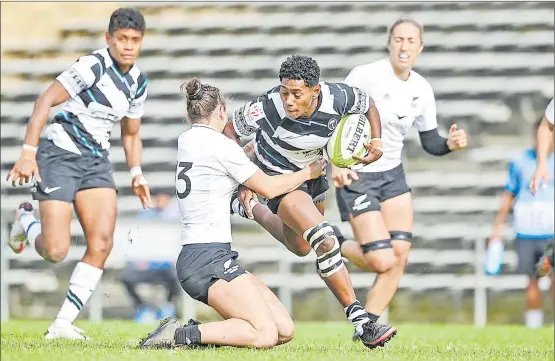  ?? Picture: ANDREW CORNAGA/PHOTOSPORT.NZ ?? Ana Naimasi of Fiji attacks against New Zealand Black Ferns Ma during the Oceania Sevens rugby union tournament at the Navigation Homes Stadium, Pukekohe, Auckland, New Zealand, yesterday.