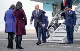  ?? EVAN VUCCI/AP ?? President Joe Biden greets officials as he arrives at Boston Logan Internatio­nal Airport to attend campaign fundraiser­s on Tuesday.