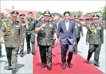  ?? SUPPLIED ?? Hing Bun Heang, chief of Prime Minister Hun Sen’s Bodyguard Unit (second from left), at a celebratio­n for the eighth anniversar­y of the force’s formation in September.