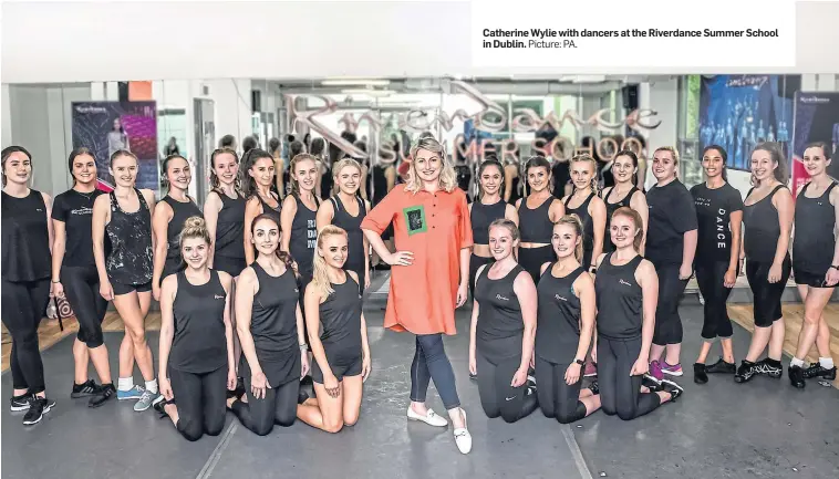  ?? Picture: PA. ?? Catherine Wylie with dancers at the Riverdance Summer School in Dublin.